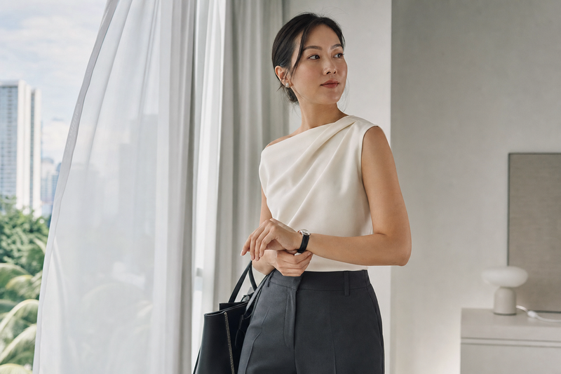 Woman in a white top, DNQ nipple covers invisible underneath
